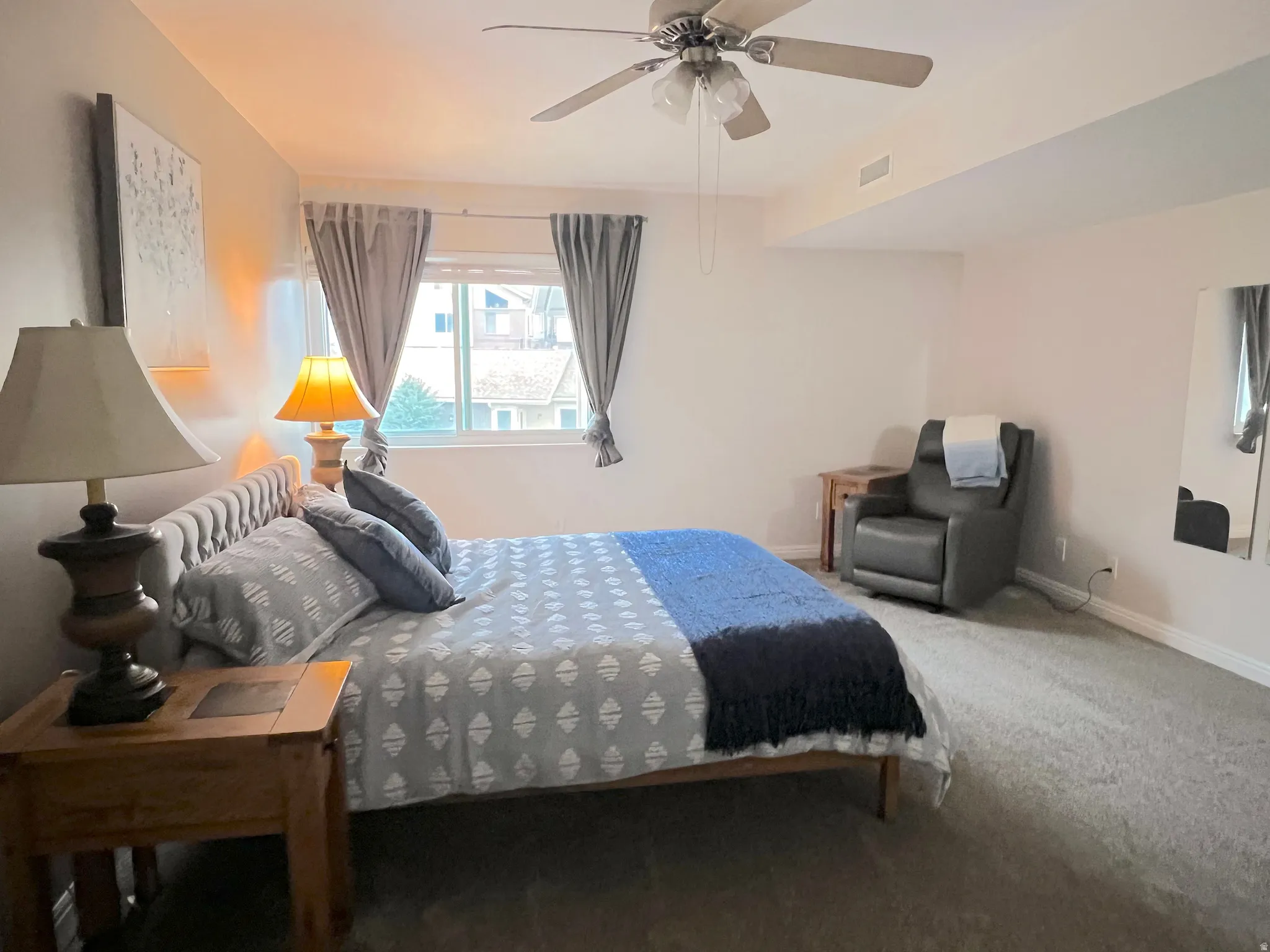 Bedroom featuring carpet flooring and a ceiling fan