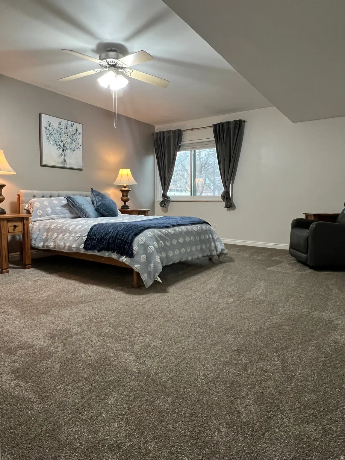 Bedroom with carpet and a ceiling fan