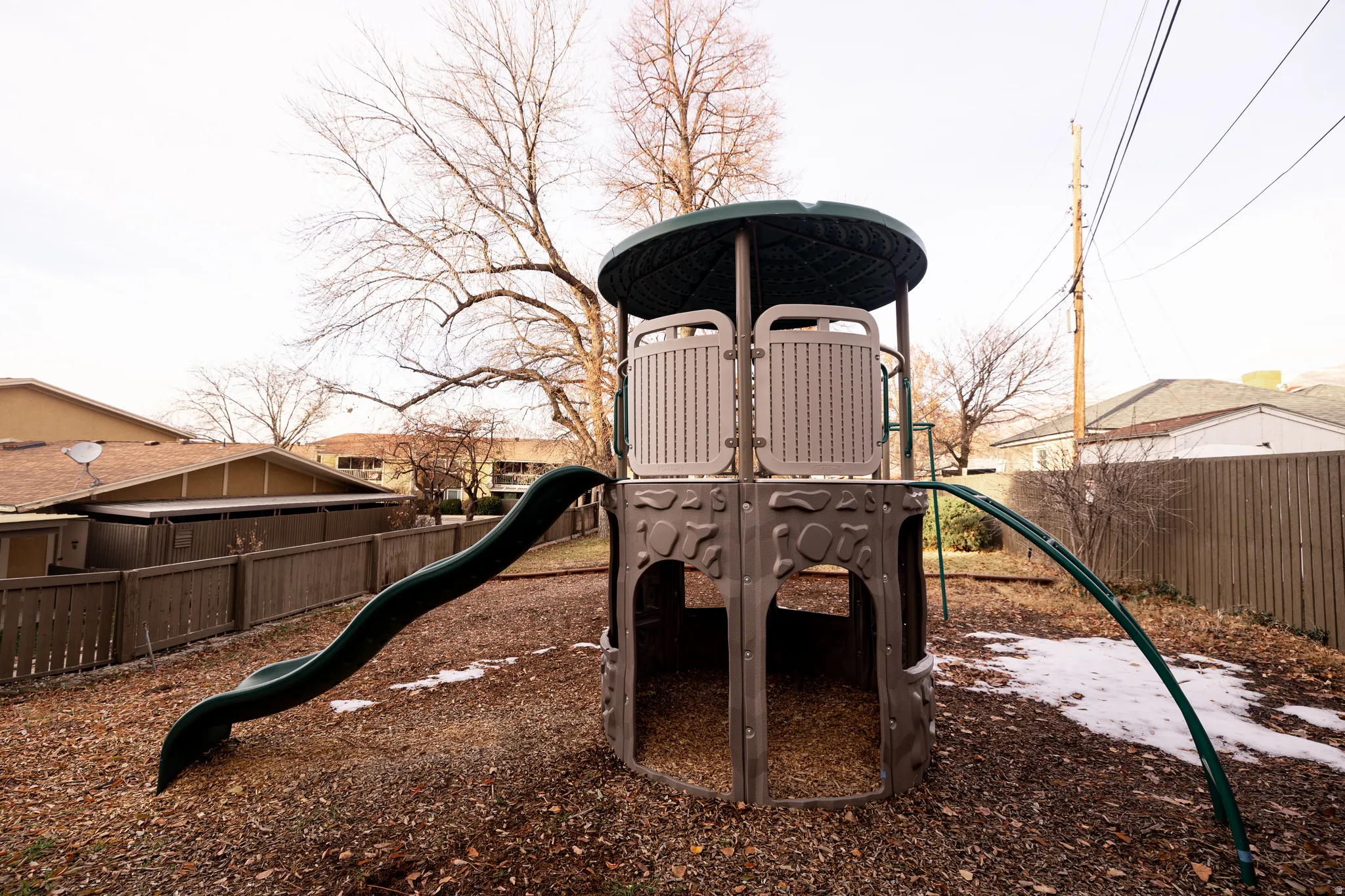 View of play area featuring a fenced backyard
