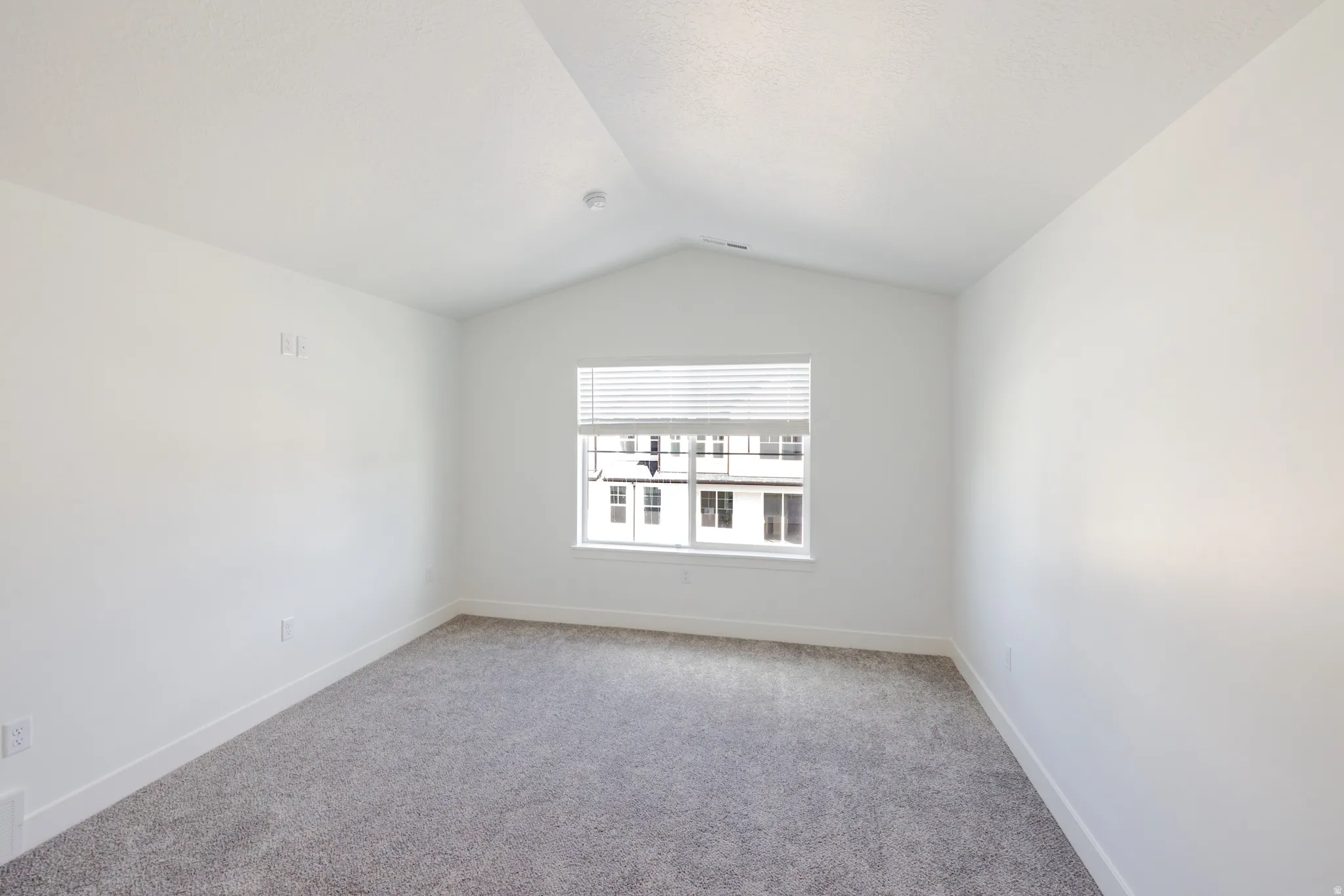 Spare room with carpet flooring and baseboards