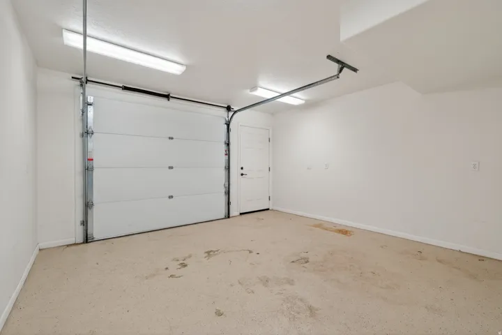 Garage featuring baseboards