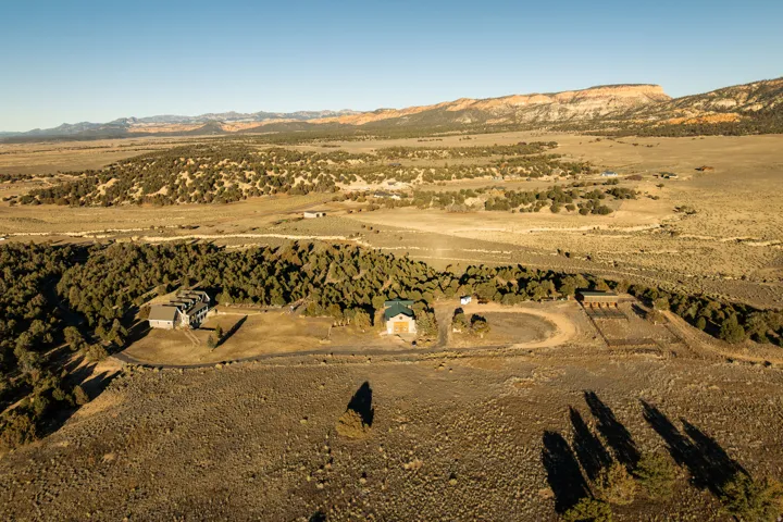 Aerial overview of property's location with mountains and rural landscape