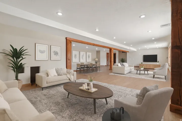Living room with wood finished floors and recessed lighting