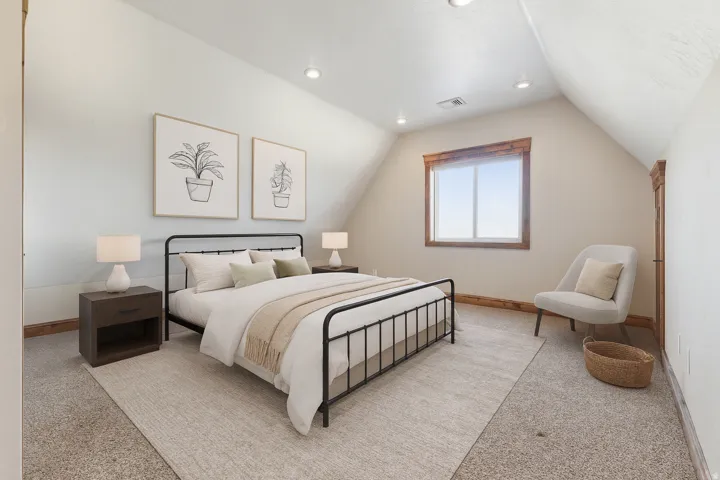 Bedroom with lofted ceiling and recessed lighting