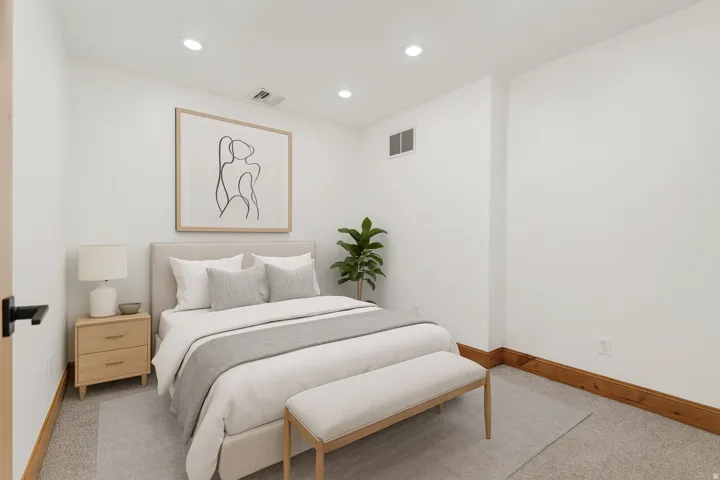 Bedroom featuring light colored carpet and recessed lighting