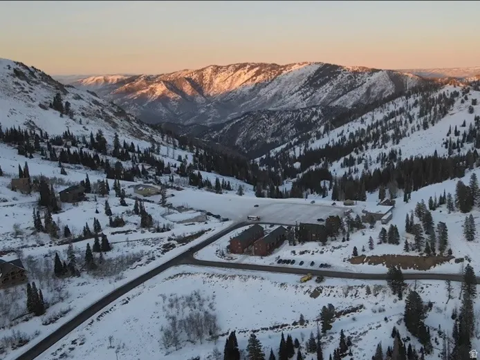 Snowy aerial view featuring a mountain view