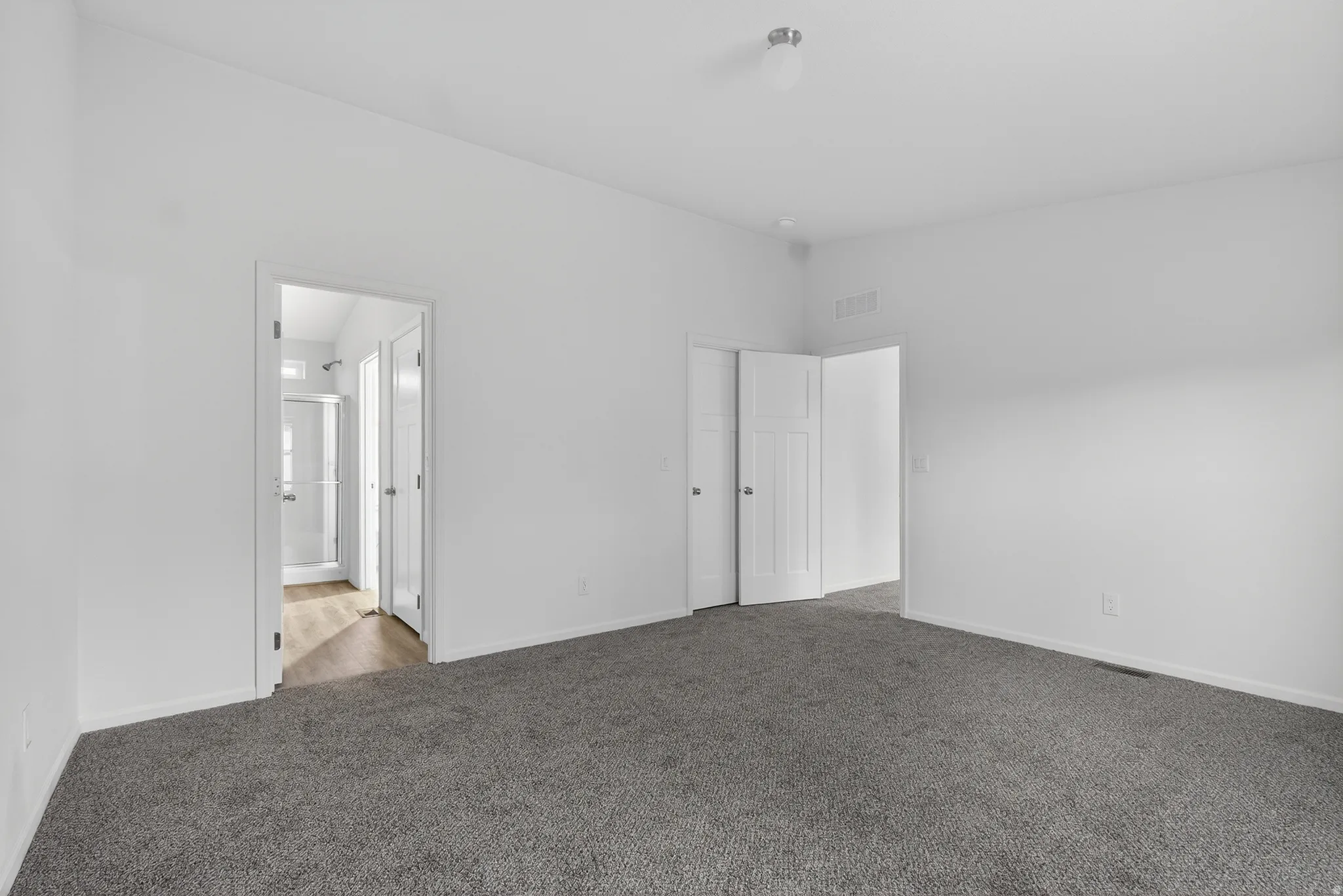 Unfurnished room featuring carpet flooring and baseboards
