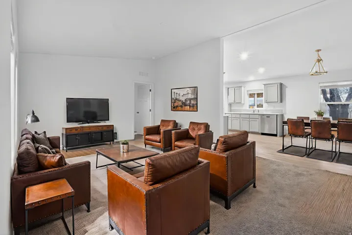 *Virtually Staged* Living room featuring lofted ceiling, light wood-style floors, and recessed lighting