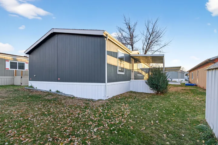 View of property exterior featuring a yard
