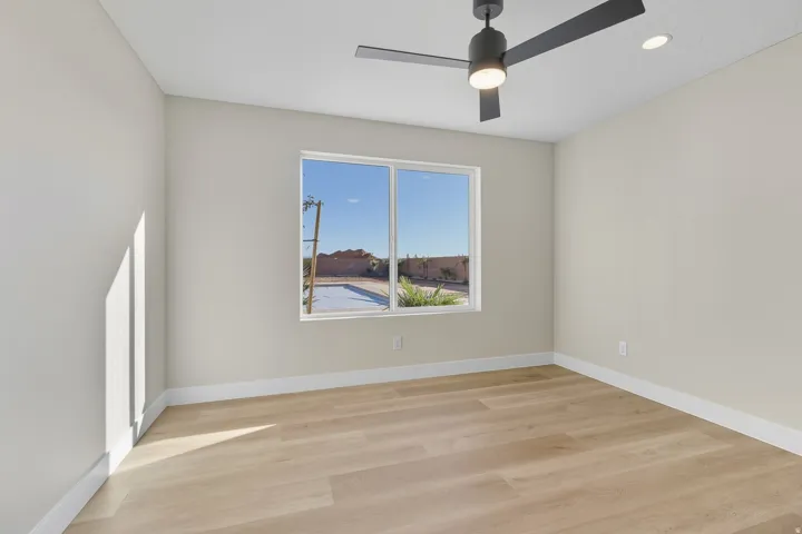 Spare room featuring light wood finished floors, recessed lighting, and a ceiling fan