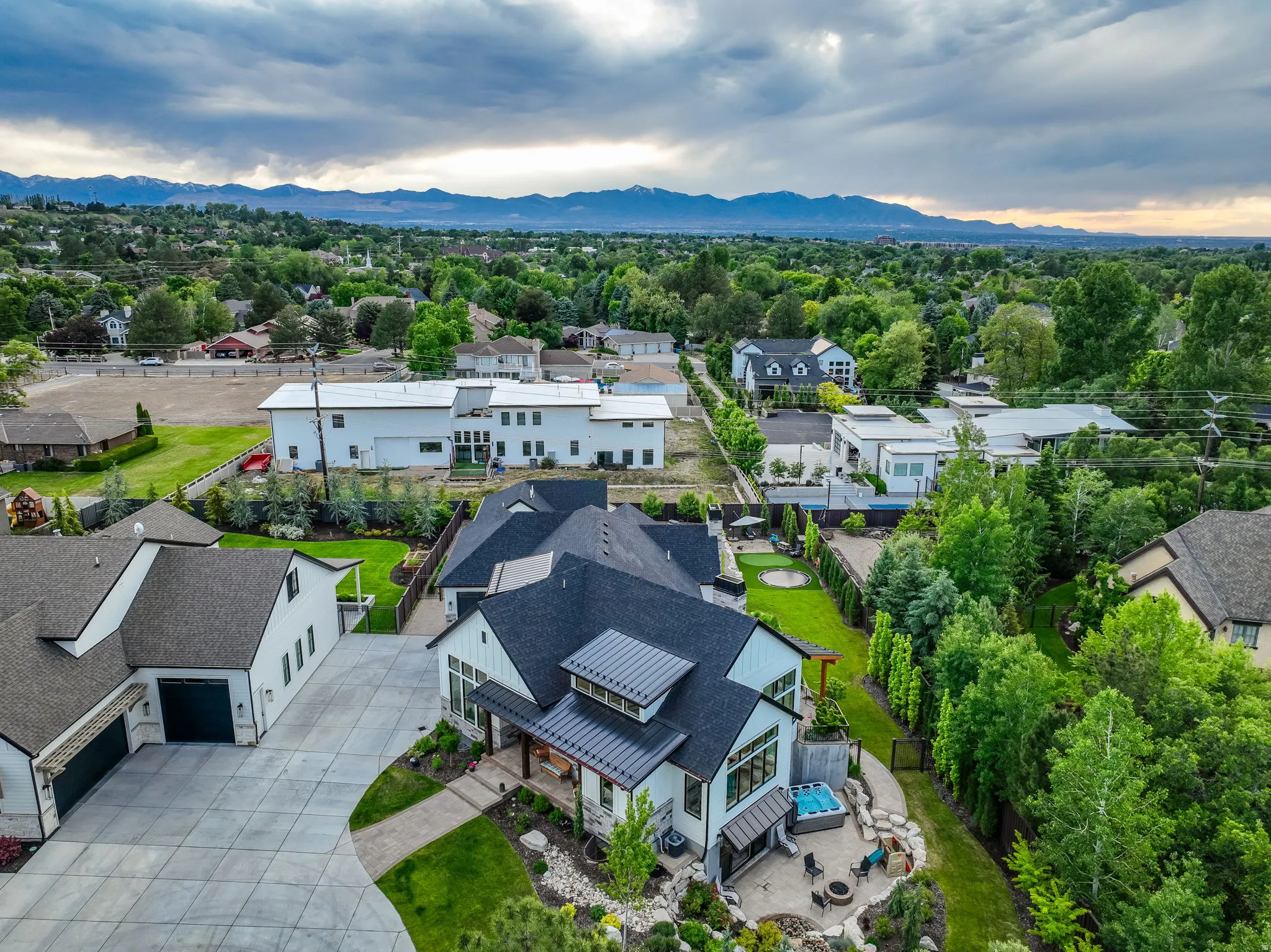 Aerial view of residential area featuring a mountain backdrop