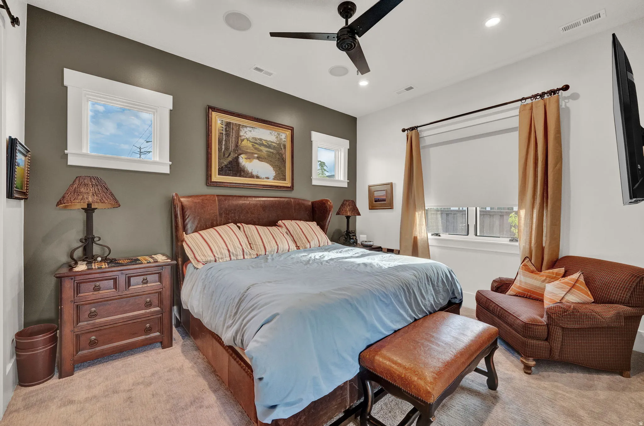 Bedroom with multiple windows, light carpet, ceiling fan, and recessed lighting