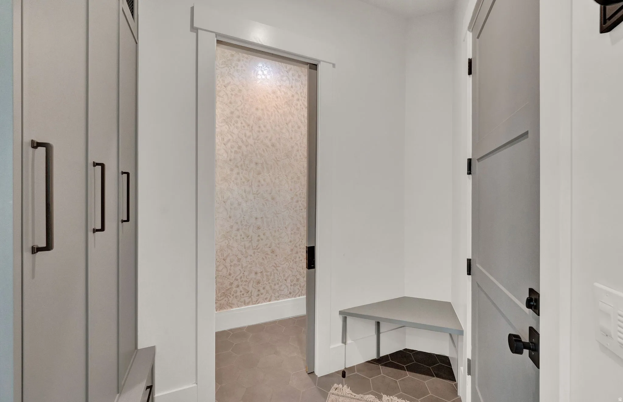 Mudroom featuring light tile patterned flooring