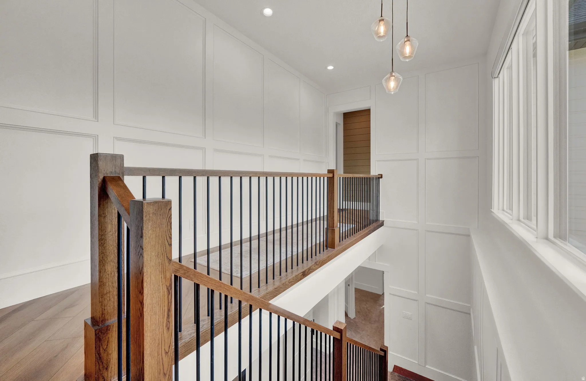 Stairs featuring a decorative wall