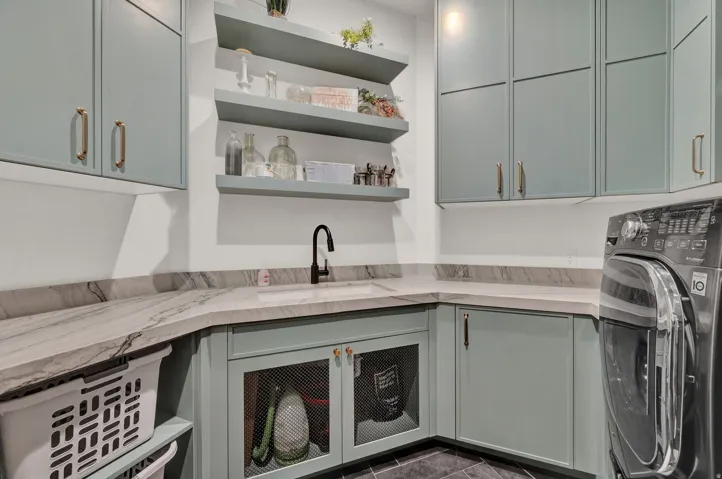 Laundry area featuring washer / clothes dryer and cabinet space