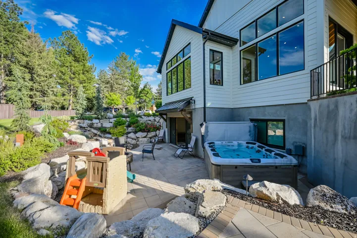 View of patio featuring a hot tub