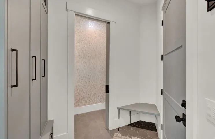 Mudroom featuring light tile patterned flooring
