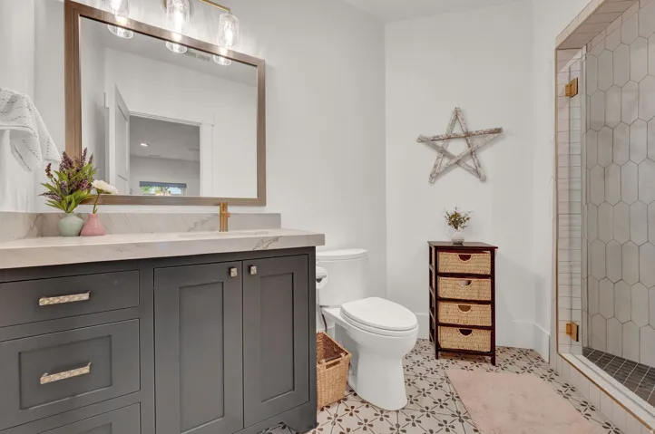 Bathroom with vanity and a stall shower