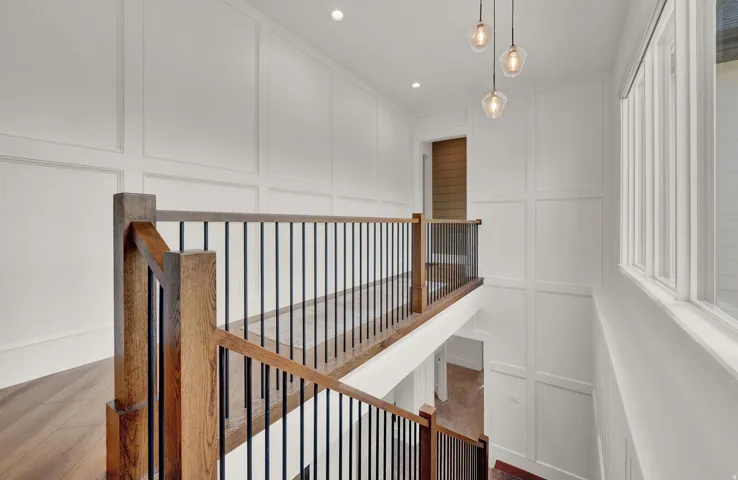 Stairs featuring a decorative wall