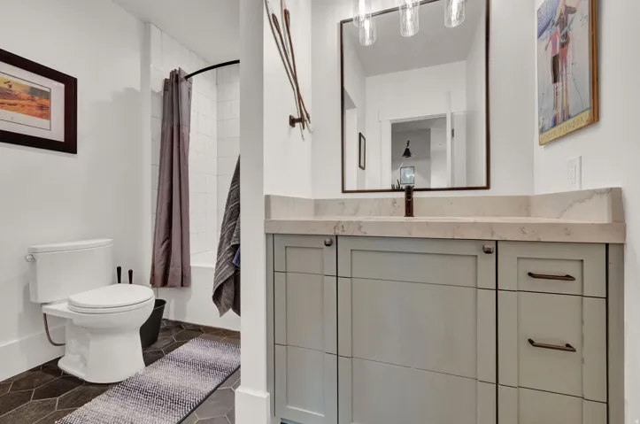 Full bath featuring vanity and shower / tub combo