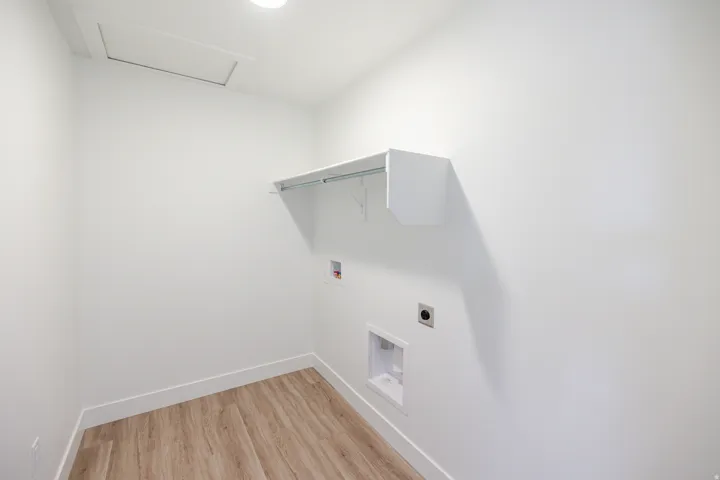 Laundry room with washer hookup, light wood-style flooring, and hookup for an electric dryer