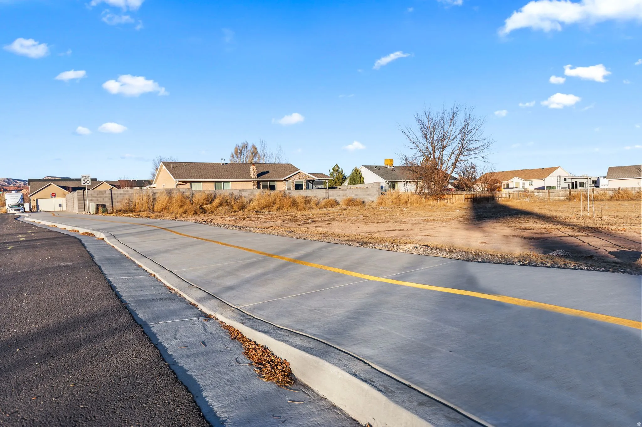 View of road featuring sidewalks and a residential view