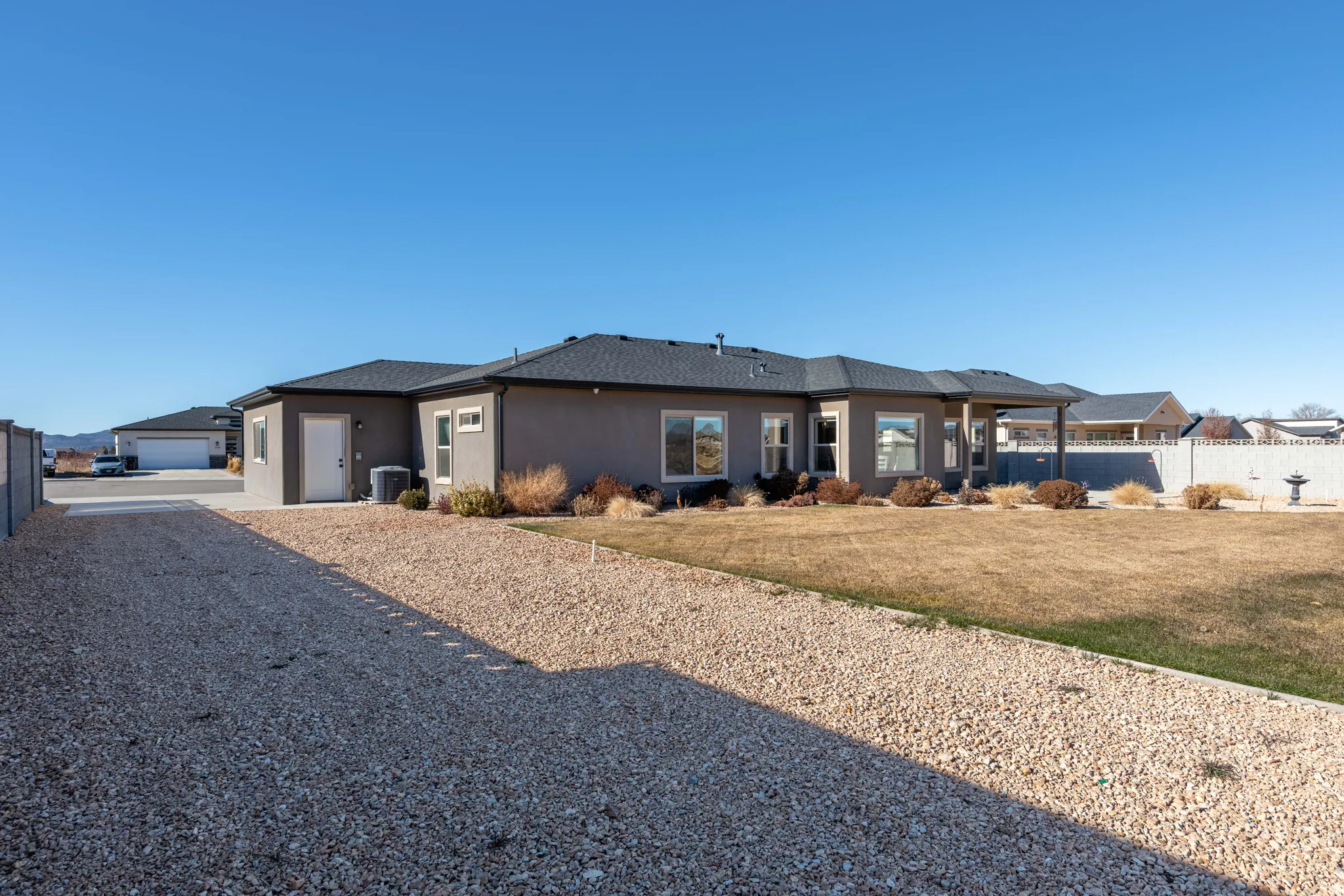 Prairie-style home with stucco siding and a garage
