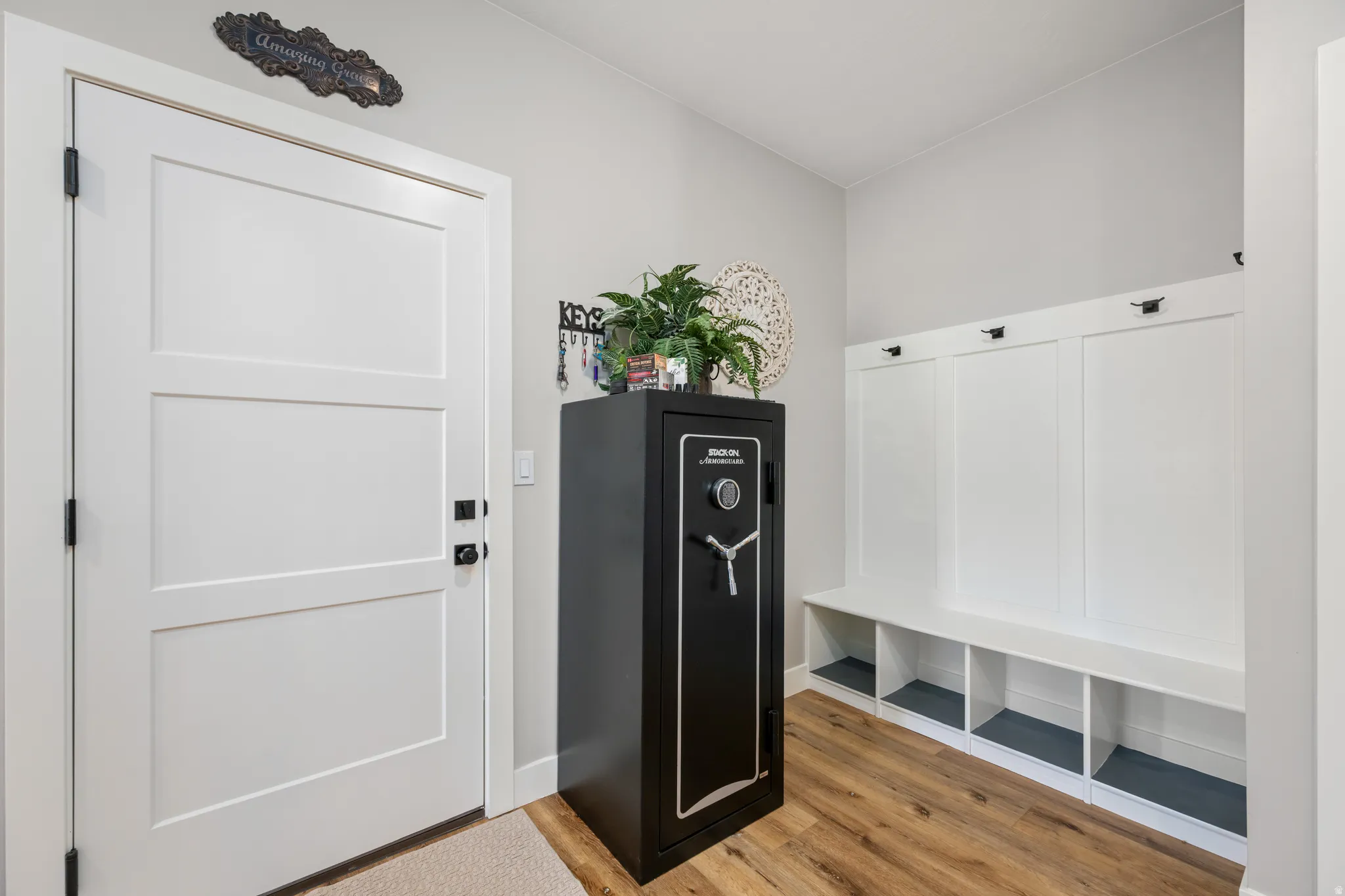Mudroom with light wood finished floors