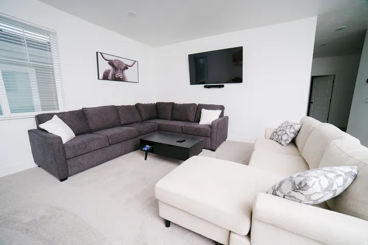 Carpeted living room with baseboards
