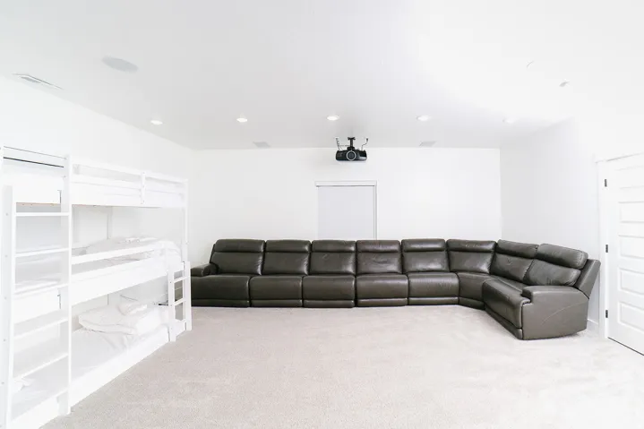 Carpeted cinema room featuring recessed lighting