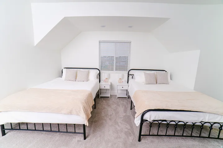 Carpeted bedroom featuring lofted ceiling