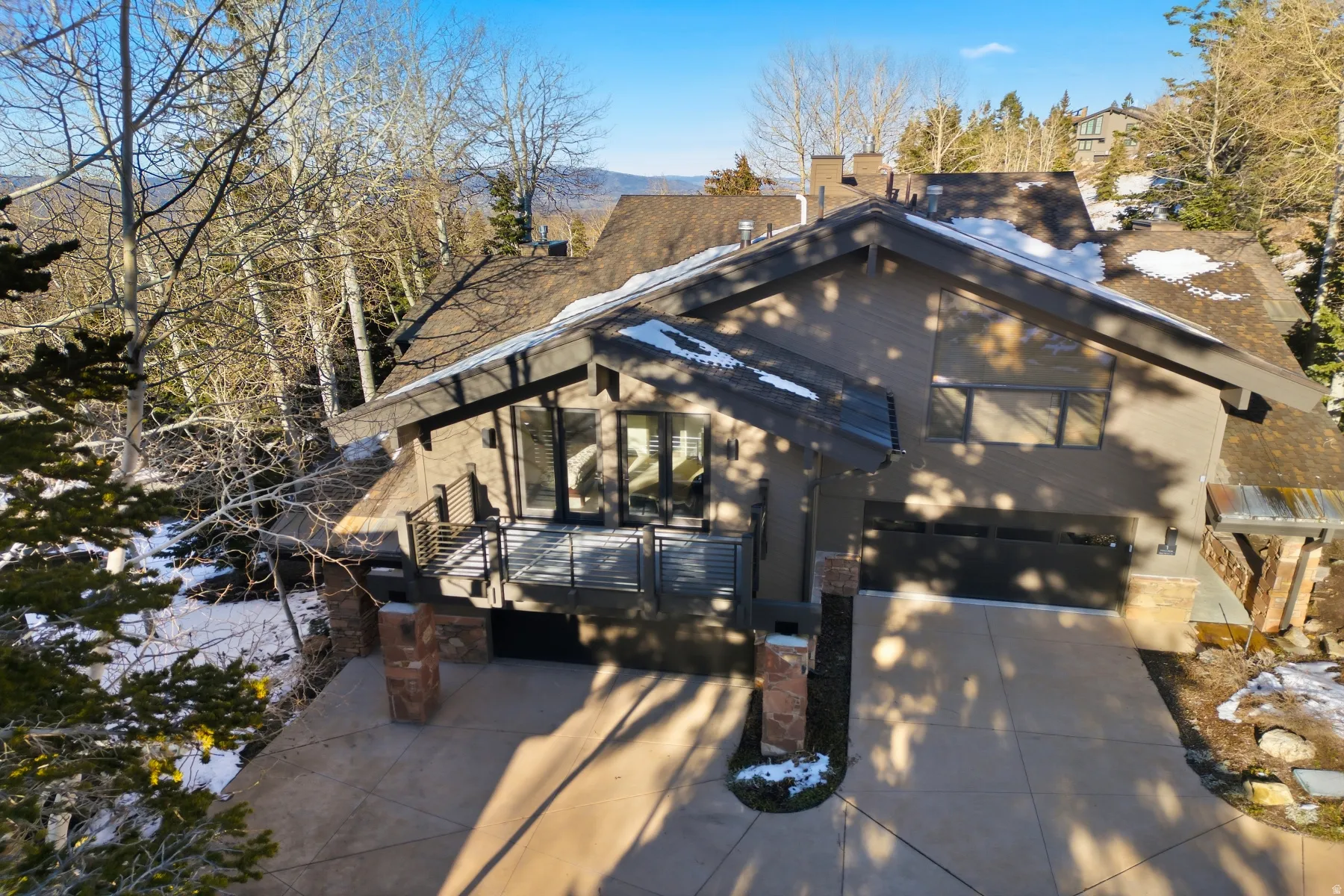 View of front of house featuring concrete driveway