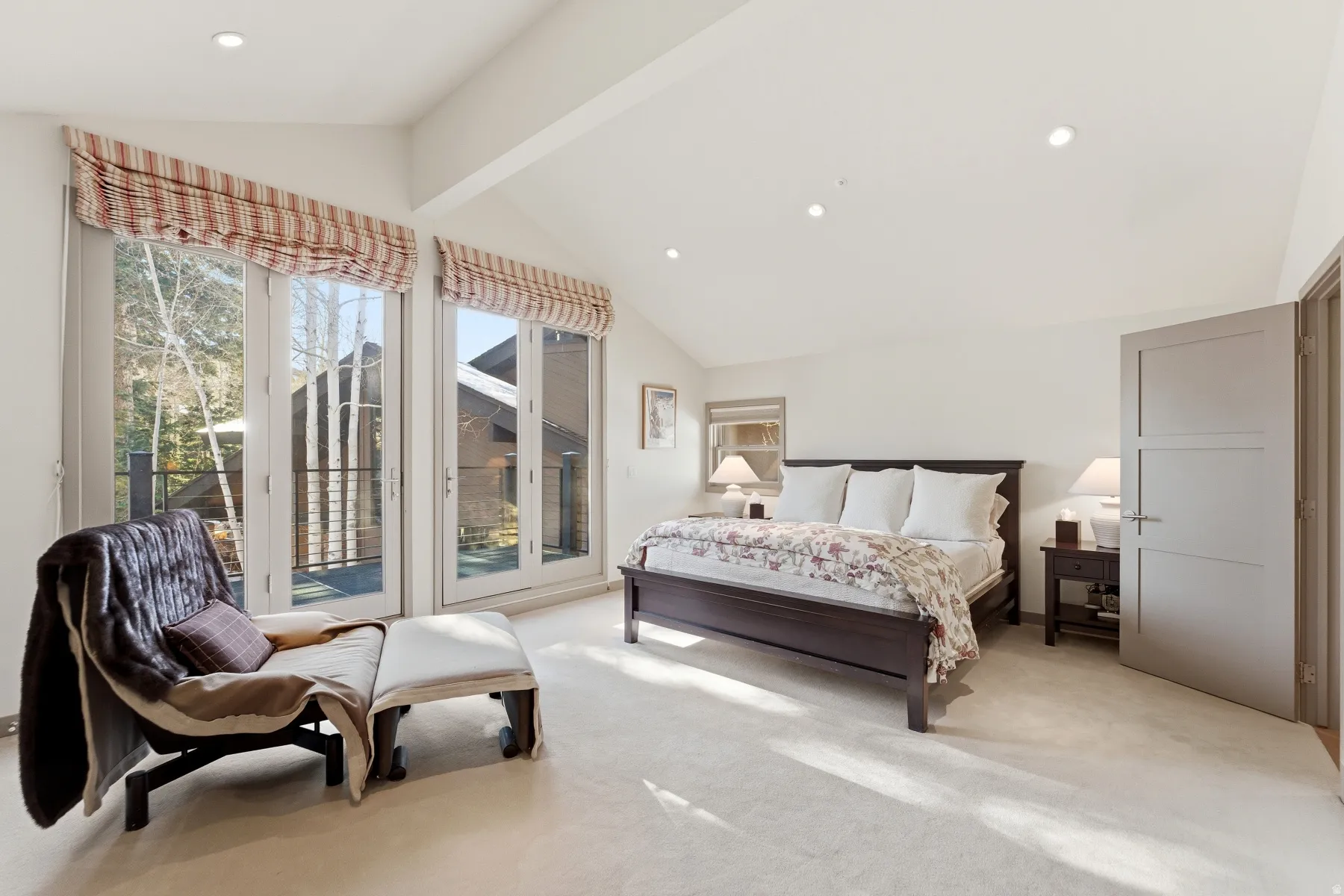 Bedroom featuring light carpet, recessed lighting, and access to exterior