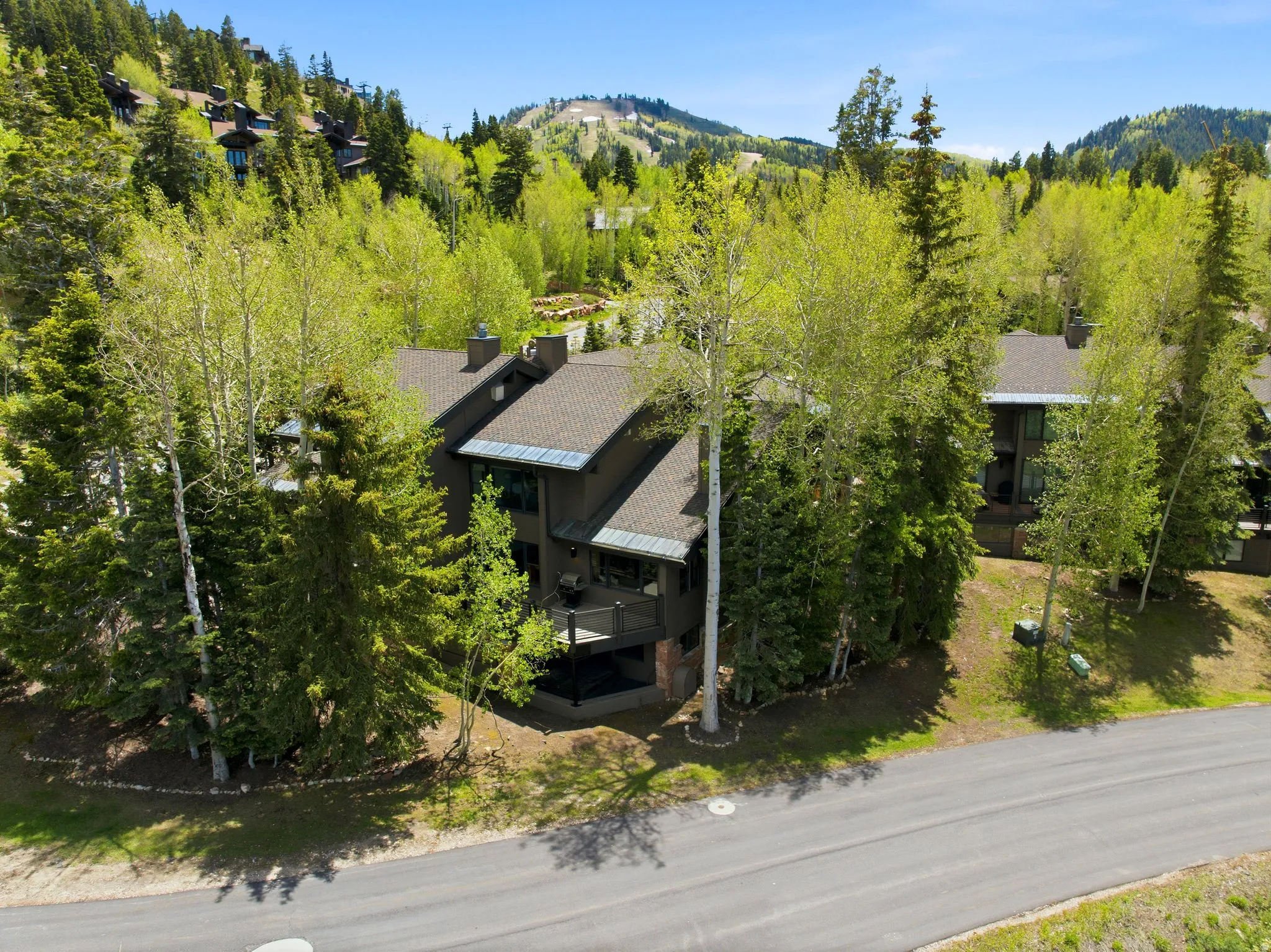Multi-level residence featuring a dark-toned exterior and multiple balconies