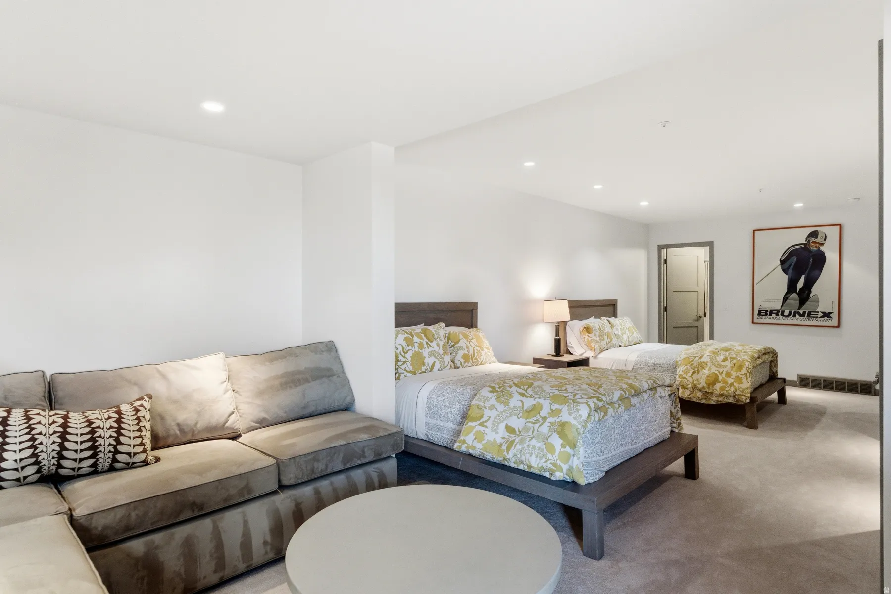 Carpeted bedroom with recessed lighting