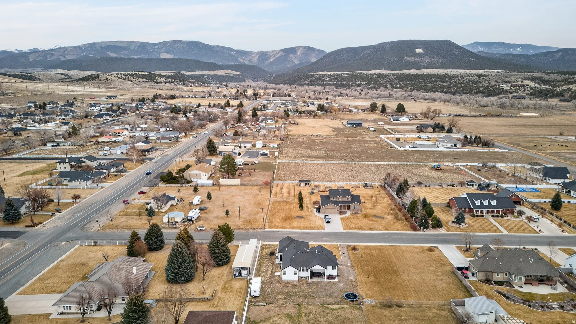 View of property location featuring nearby suburban area and a mountainous background