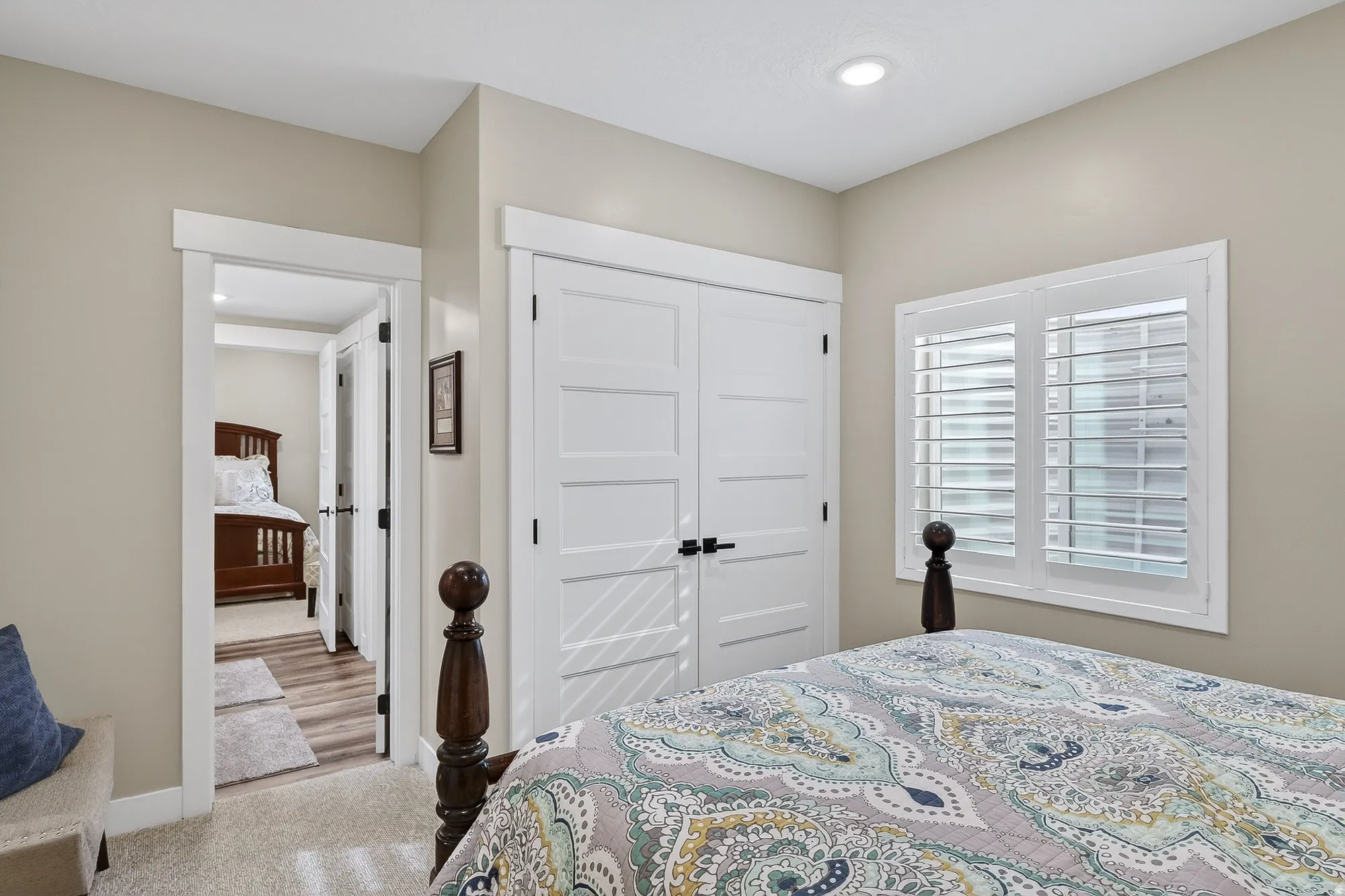 Bedroom with carpet floors and a closet