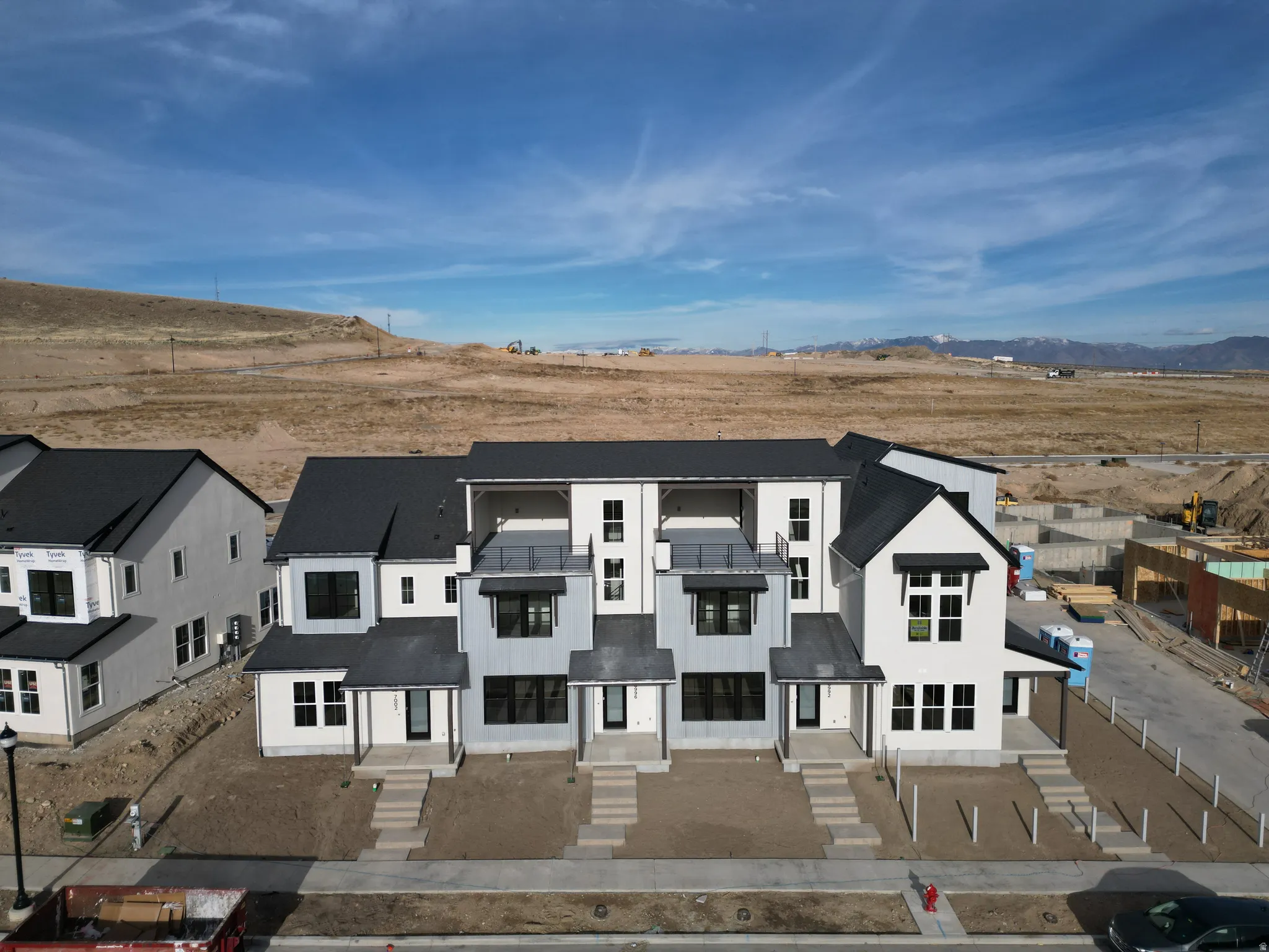 Aerial view of front of home featuring a view of countryside