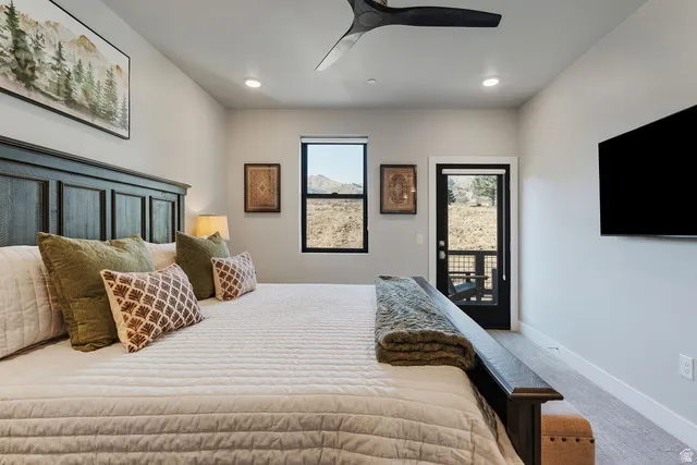 Bedroom with access to exterior, carpet, ceiling fan, and recessed lighting