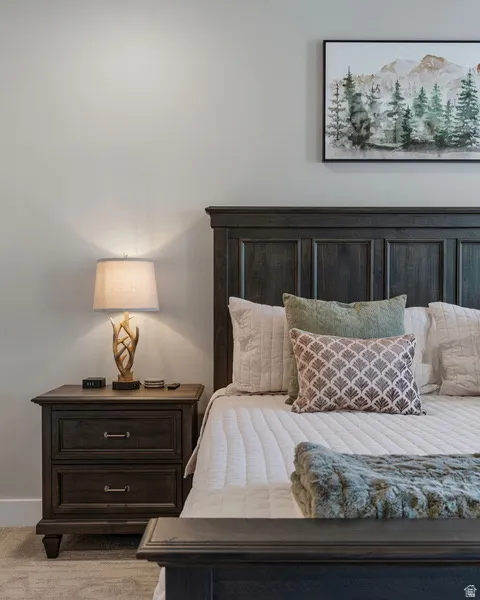 Bedroom with light colored carpet