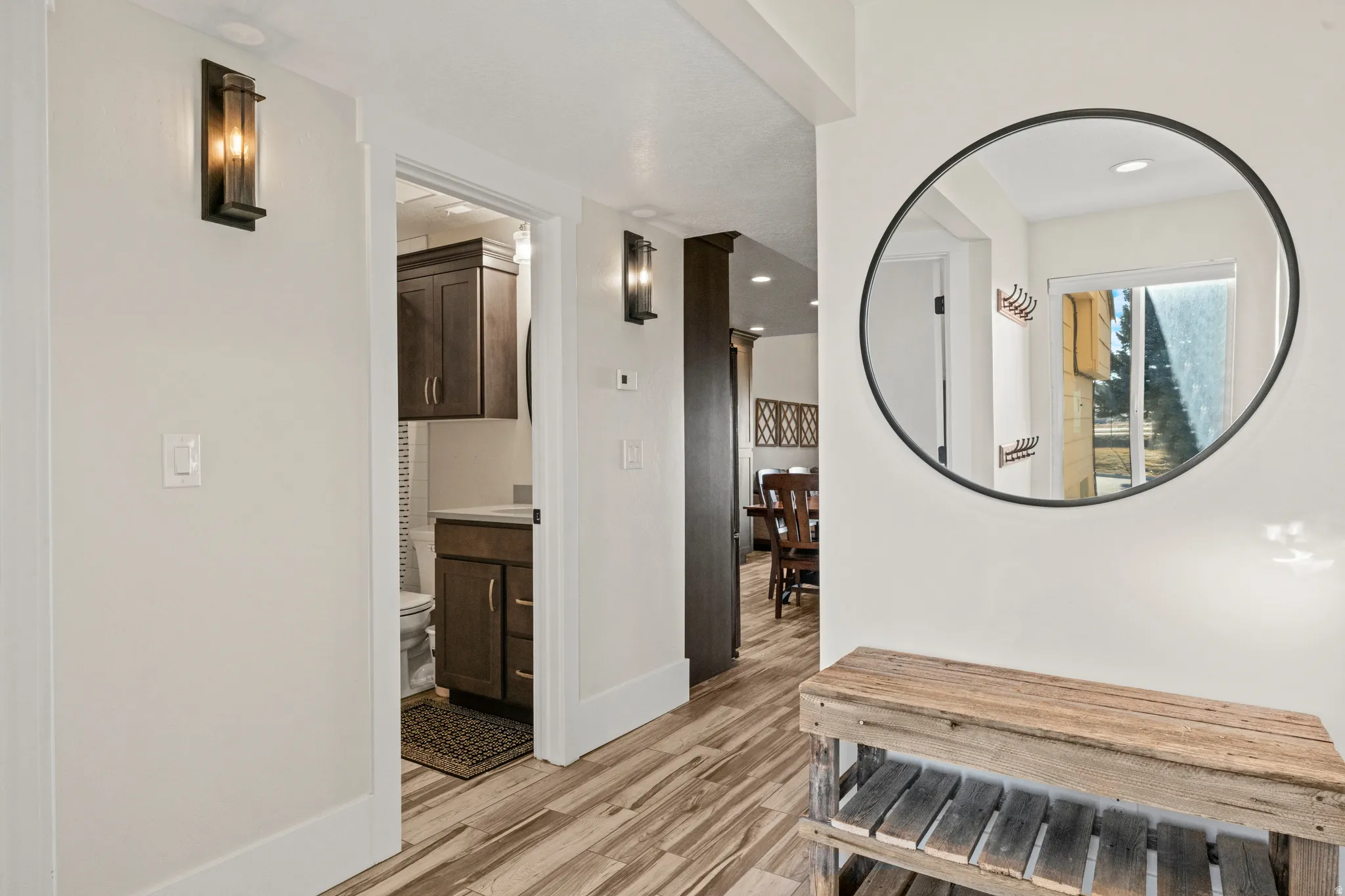Hall featuring light wood-style floors and recessed lighting