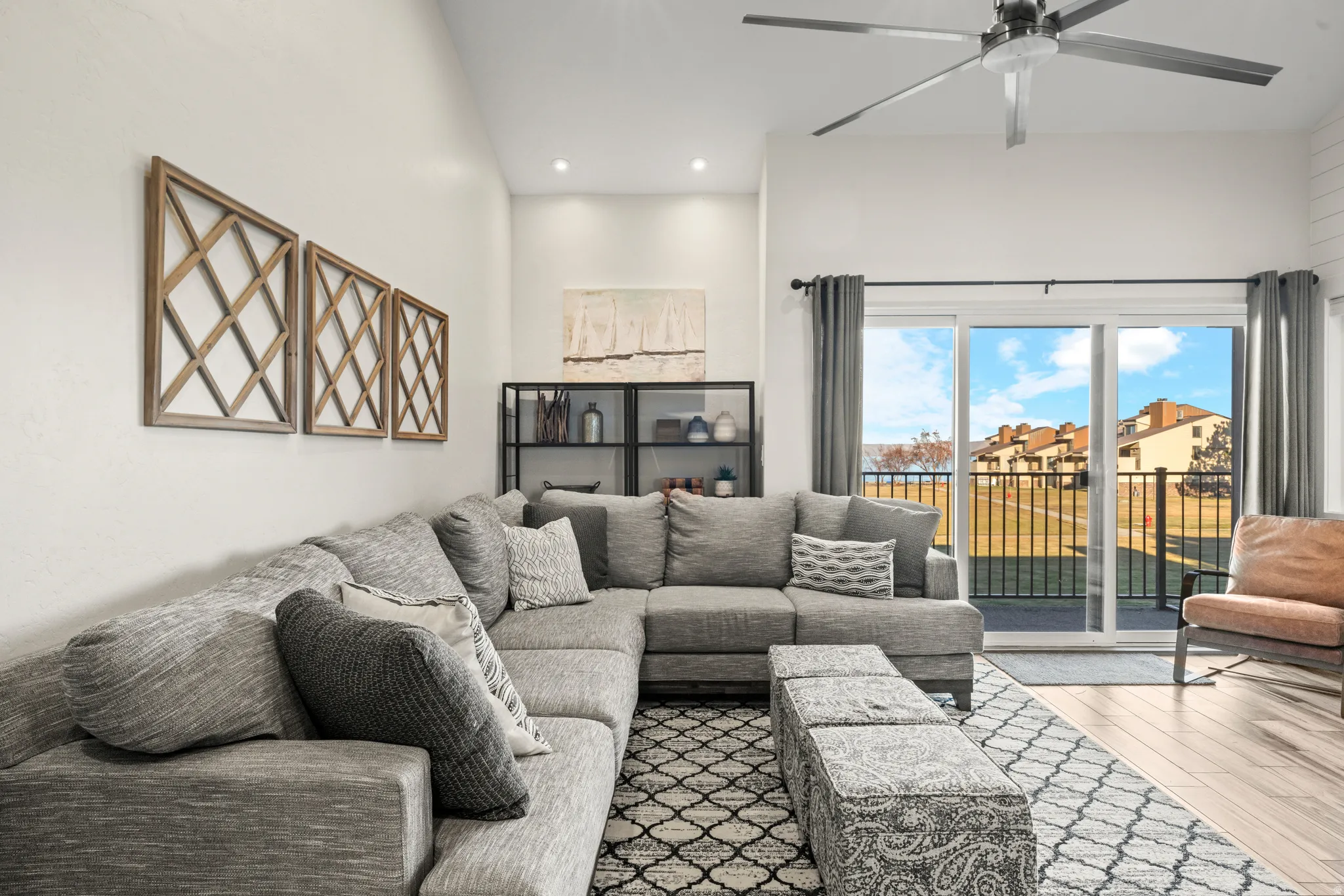 Living area with wood-type flooring, recessed lighting, and a ceiling fan