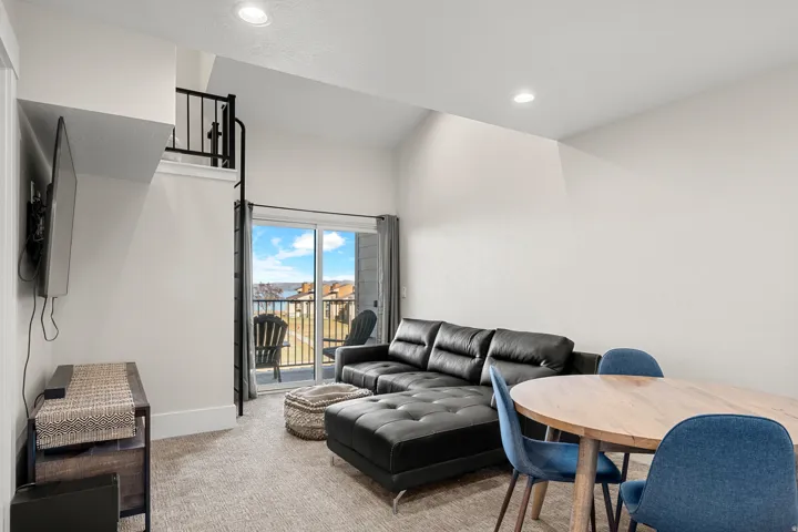 Carpeted living area with recessed lighting
