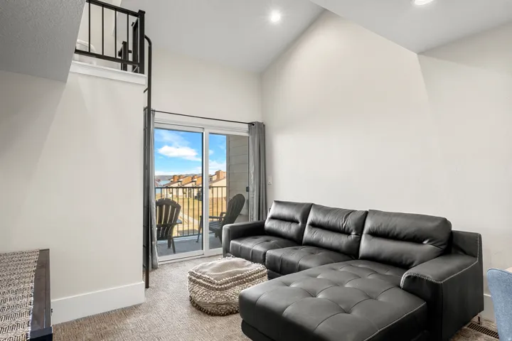 Carpeted living room with baseboards