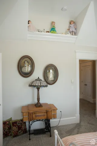 Detailed view of carpet flooring and baseboards