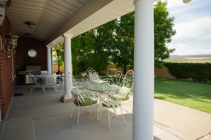 View of patio / terrace with outdoor dining area and area for grilling