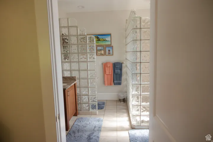 Bathroom with vanity and light tile patterned floors