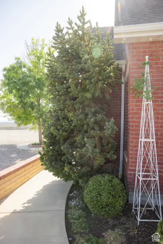 View of side of home featuring brick siding