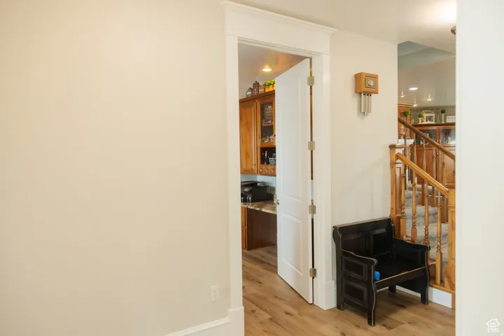 Hallway featuring light wood-style floors and stairway