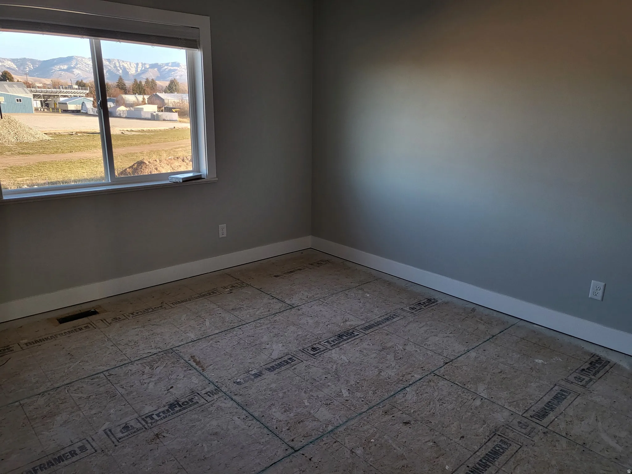 Another Big Bedroom with baseboards and a closet.